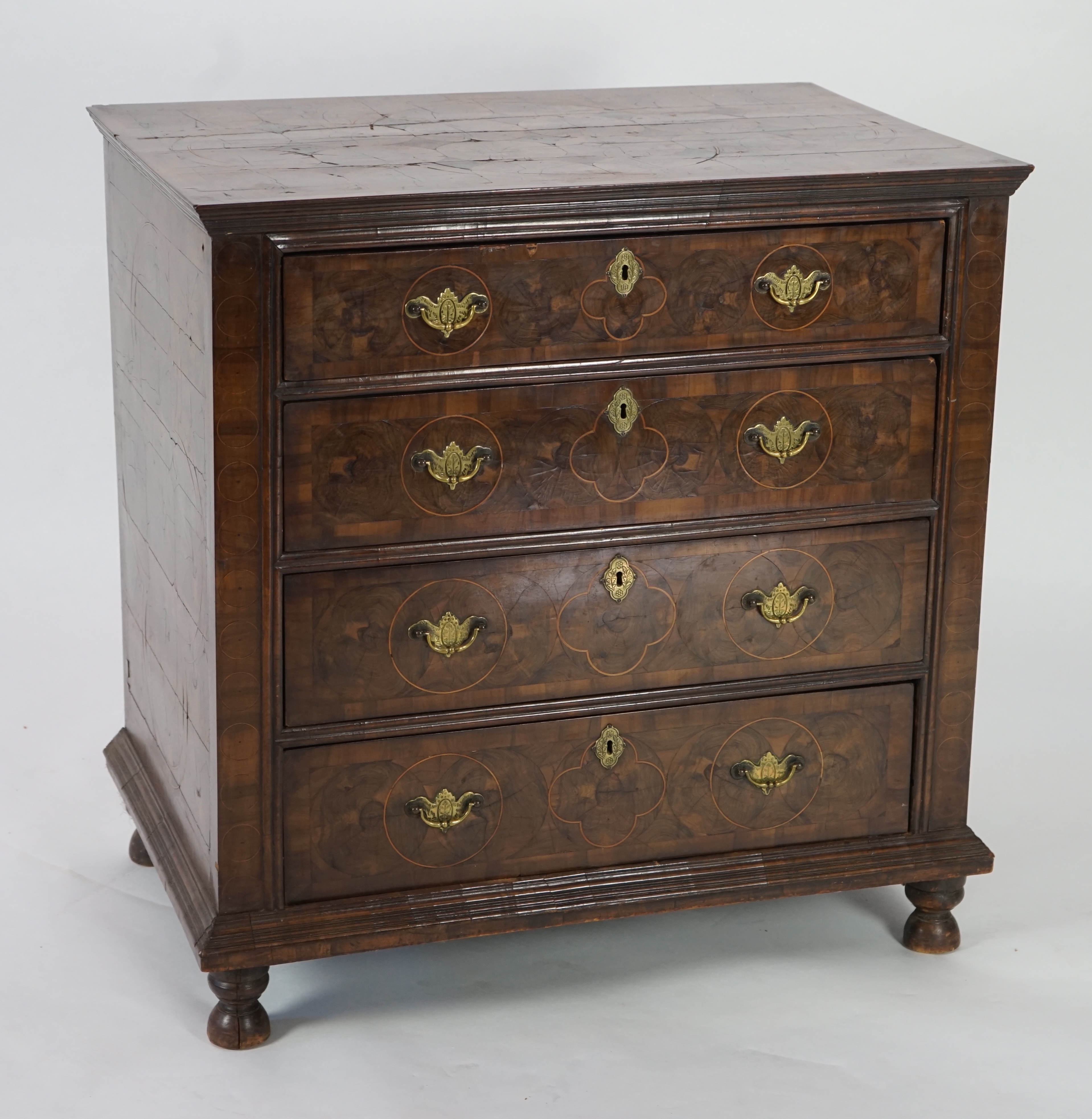 A William and Mary oyster veneered laburnum and walnut chest